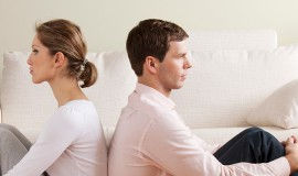 couple with backs to each other